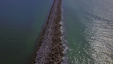 Aerial-footage-of-the-Newport-Harbor-jetty,-in-Newport-Beach-California
