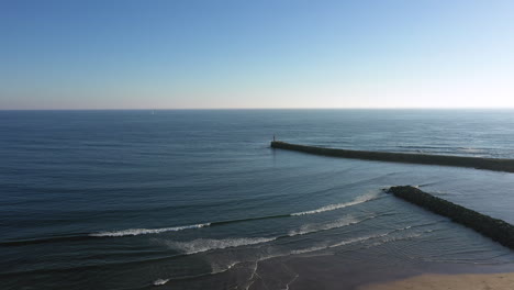 Drone-shot-of-Atlantic-ocean-a-calm,-clear-day,-Azurara,-Vila-do-Conde