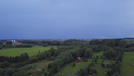 Aerial-Shot-of-a-Lightning-Strike-in-a-Distance-over-a-Countryside