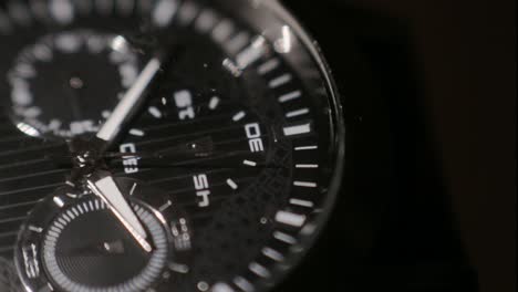 A-beautiful-black-analog-watch-in-black-background---Close-up