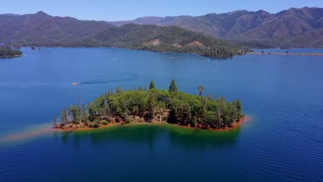 A-Beautiful-Open-Lake-Of-Whiskeytown-In-California-Showing-Hills-And-Mountains-Covered-With-Plenty-Of-Green-Trees-From-Afar---Aerial-Shot