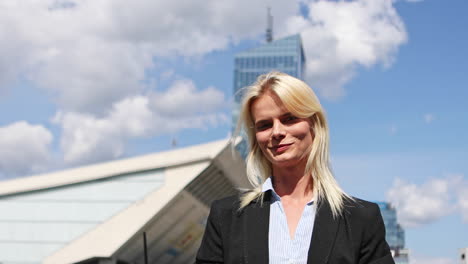 Portrait-of-a-businesswoman-against-the-background-of-office-buildings