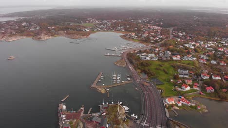 Drone-aerial-view-of-dockyard-for-car-ferries-in-Gothenburg's-northern-archipelago,-Sweden