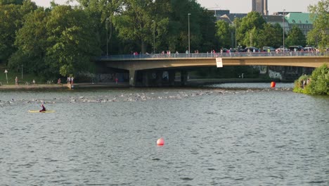 Slow-motion-shot-of-the-outer-alster-lake-with-swimmmers-during-Ironman-in-Hamburg
