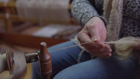 Spinning-wheel.-A-woman-is-spinning-wool