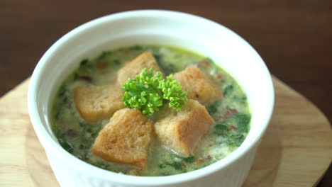 spinach-soup-with-bread-in-white-bowl