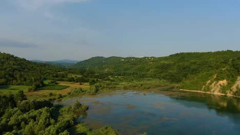 Lake-Butoniga-water-dam-in-Croatia-Istria-peninsula-closing-in-lower-altitude,-Aerial-drone-approach-shot