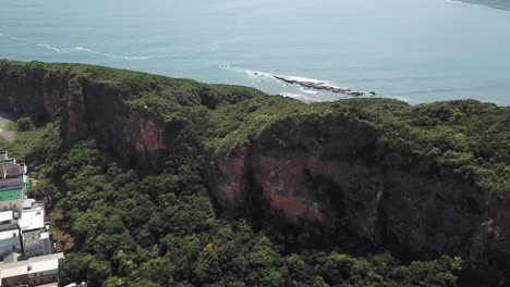 Aerial-View-on-Limestone-Hill-and-Steep-Cliff-By-North-China-Sea,-Waterfront-of-North-Taiwan-Near-Yehliu-Geopark