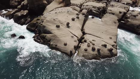 Aerial-View-of-Waves-Breaking-on-Scenic-Eroded-Coast-of-Heping-Island-Park,-Taiwan