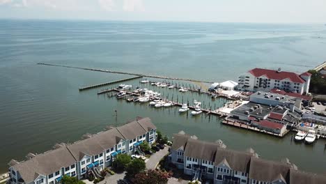 Chesapeake-Beach-Bay,-Maryland-USA,-Drone-Aerial-View-on-Upscale-Condos-and-Hotel-With-Jetty-and-Boats-in-Harbor