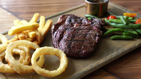 medium-rare-beef-steak-with-vegetable-and-french-fries