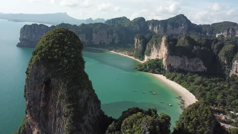 Drone-Aerial-View-of-Iconic-Railay-Beach,-Krabi-Thailand,-Seacliffs-Over-White-Sand-and-Rainforest,-Tropical-Paradise