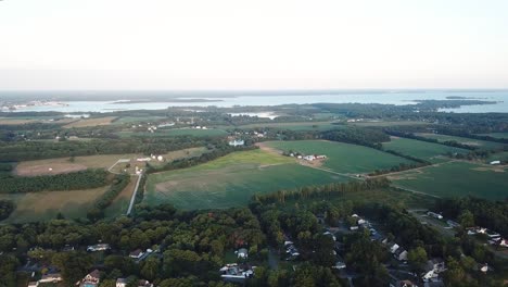 Aerial-View-on-Inland-of-Kent-Island,-Green-Meadow,-Forest-and-Coast-of-Chesapeake-Bay,-Maryland-USA