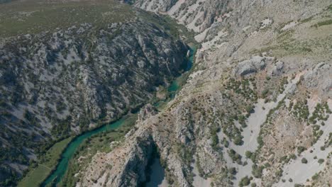 Zrmanja-river-canyon-aerial-view-following-valley-curved-terrain-wild-landscape,Croatia