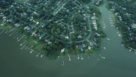 Birdseye-Aerial-View-on-Picturesque-Coast-of-Kent-Island,-Docks-and-Upscale-Houses-in-Twilight