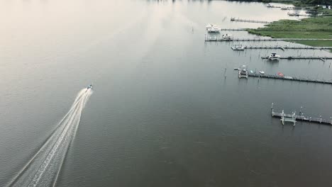 Motor-Boat-Sailing-on-Water-of-Cox-Creek,-Kent-Island,-Chesapeake-Bay,-Maryland-USA,-Birdseye-Aerial-View
