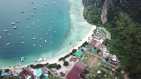 Aerial-View-on-Scenic-Coast,-Beach-and-Boats-in-Sea-on-Koh-Phi-Phi-Don,-Main-Island-of-Phi-Phi-Archipelago,-Krabi,-Thailand
