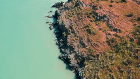 Drone-shot-of-cliffs-and-beach-in-summer