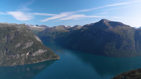 Aerial-view-of-a-norwegian-fjord,-path-reveling-the-geiranger-fjord