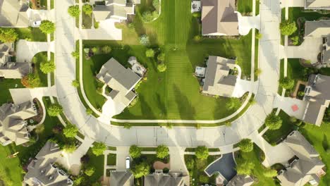 Aerial-Birds-Eye-View-of-Suburban-Homes-in-Clean-Neighborhood
