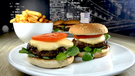 Placing-a-slice-of-a-tomato-on-a-delicious-homemade-cheeseburger,-STILL