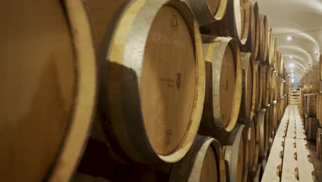 Portugal-wine-cellar-at-basement-with-barrels-in-a-row-on-camera-travel