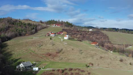 Pohorje-wine-road,-tourist-attraction-near-Slovenska-Bistrica-with-scenic-countryside,-vineyards-and-vinery-locations,-aerial-view-of-landscape-in-Slovenia
