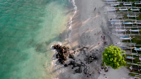Aerial-flyover-a-tourist-beach-in-Bali