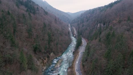 Drone-flight-over-a-river-gorge-with-a-road-running-next-to-it