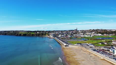 Aerial-bird's-eye-view-of-Tramore-Beach,-Waterford-during-beautiful-day