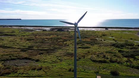 Static-aerial-of-Wind-Turbine-generating-green-energy-in-Waterford,-Ireland