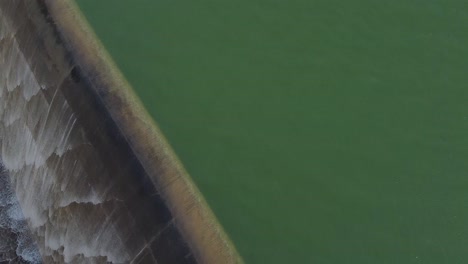 Low-flying-aerial-shot-over-the-Asprokremmos-Dam-during-an-overload