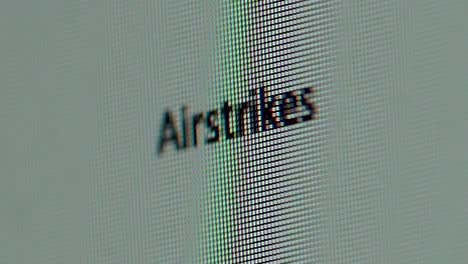 Term-Airstrikes-being-typed-out-on-computer-screen-extreme-macro