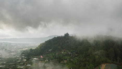 Epic-Aerial-Hyperlapse---Flying-Through-Dramatic-Clouds-around-Hills-of-North-Bali,-Indonesia
