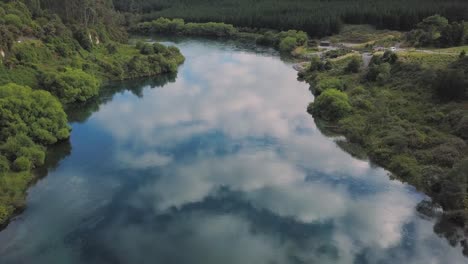 Aerial-view-over-the-calm-waters-of-the-Waikato-River-in-Taupo,-New-Zealand