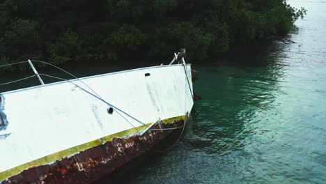 Panama-abandoned-broken-shipwreck-vessel-on-scenic-tropical-island-coastal-seascape