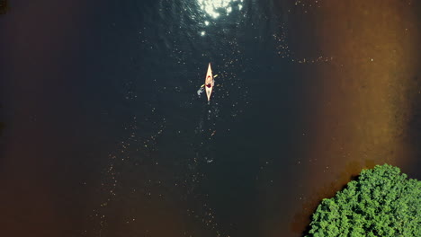 Flying-Above-Lone-Female-Kayaker-Unveiling-Tropical-River
