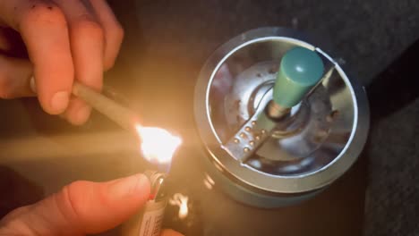 Cropped-view-of-man-lighting-up-blunt-with-medical-cannabis
