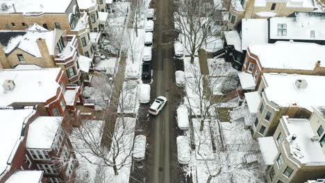 Birds-Eye-View-of-Car-Parallel-Parking-in-Winter-on-City-Street