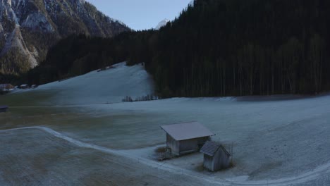 4K-anamorphic-aerial-Drone-footage-of-a-rural-farming-field-in-the-Bavarian-alps-near-Berchtesgaden-in-southern-Germany-in-the-mountains