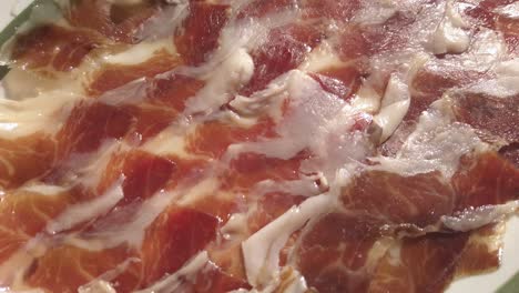 Spanish-Iberian-Ham,-Jamon-Iberico,-in-Sunlight,-Close-Up-Detail-Shot