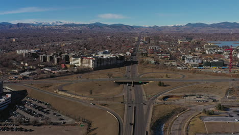 Aerial-drone-footage-of-highway-traffic-west-of-downtown-Denver,-Colorado