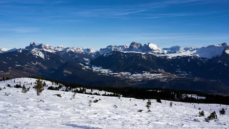 Stunning-winter-timelapse-view-of-the-Dolomites-famous-snow-capped-mountains-from-across-the-valley-on-the-slopes-of-the-Rittner-Horn-near-Bolzano-in-the-Italian-Alps