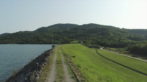 Dolly-drone-shot-along-the-edge-of-Lake-Butoniga-in-Croatia