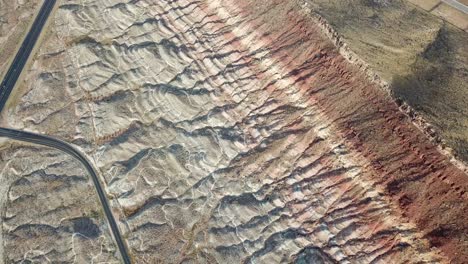 Impressive-Sandstone-Rock-Formation-and-Desert-Road-in-Utah-USA,-Quail-Creek-State-Park,-Aerial-View