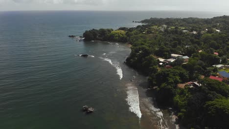 Revealing-north-coast-aerial-of-Toco-fishing-depot-in-the-rural-fishing-community-of-Toco,-Trinidad