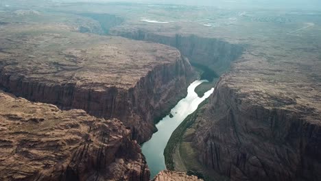 Aerial-View-of-Scenic-Colorado-River-Canyon-With-Sandstone-Cliffs-on-Horseshoe-Bend,-Arizona-USA