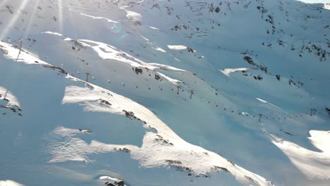 Hochzillertal---Austria-Aerials-of-the-mountains-and-ski-lines-with-blue-skies-in-a-sunny-day