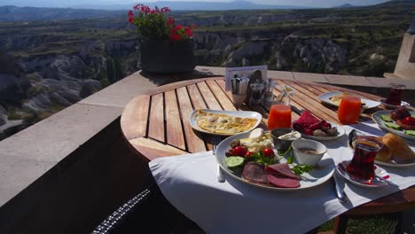 Turkish-watermelon-breakfast-at-cave-hotel-in-cappadocia-with-a-spectacular-view-of-historic-town-and-valley-of-Uchisar-in-Turkey