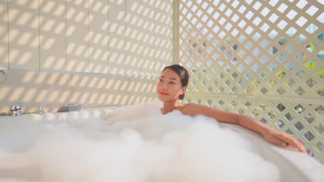 Beautiful-Asian-girl-Sitting-in-Foam-Bath